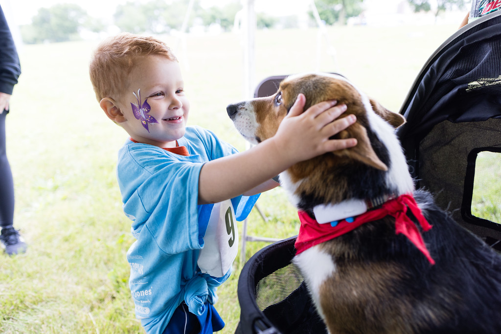 Image of kid petting dog