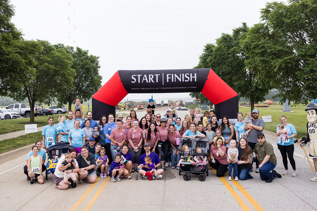 Image of runners at the start/finish line of race.