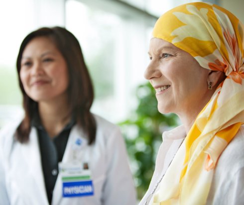 Cancer patient smiling with physician