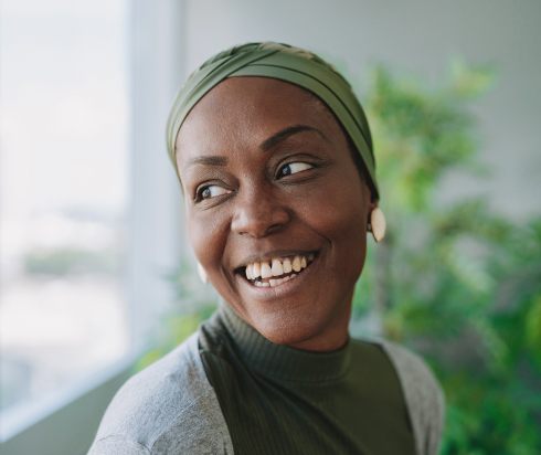 Woman smiling out window