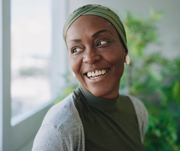 Woman smiling out window