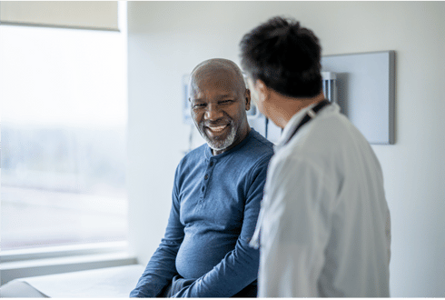 Dr. John Lanman Clinic physician and patient having conversation.