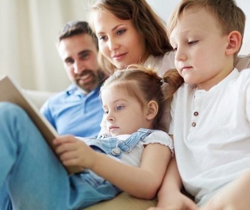 Family reading book together
