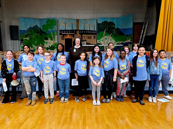 Sister M. Petra Nielsen, vice president of mission integration for Franciscan Health’s Northern Indiana division (center) stands with Joy Elementary School Better World Day student leaders following an assembly at the school last week.