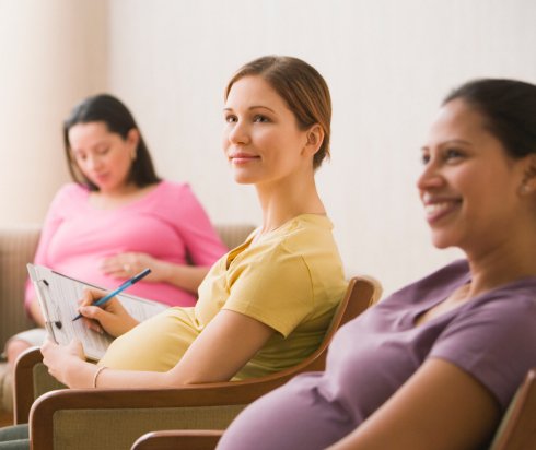 Pregnant women listening during prenatal class