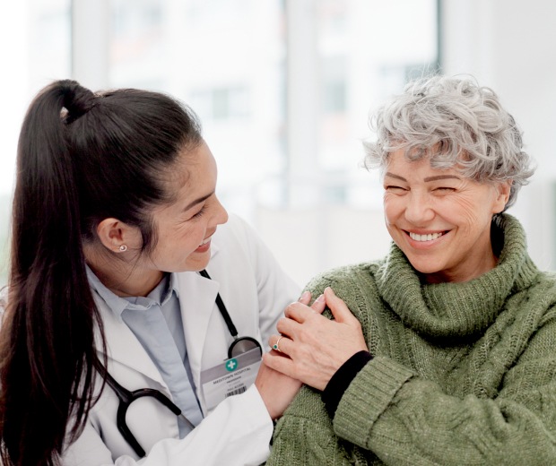Doctor smiling with patient