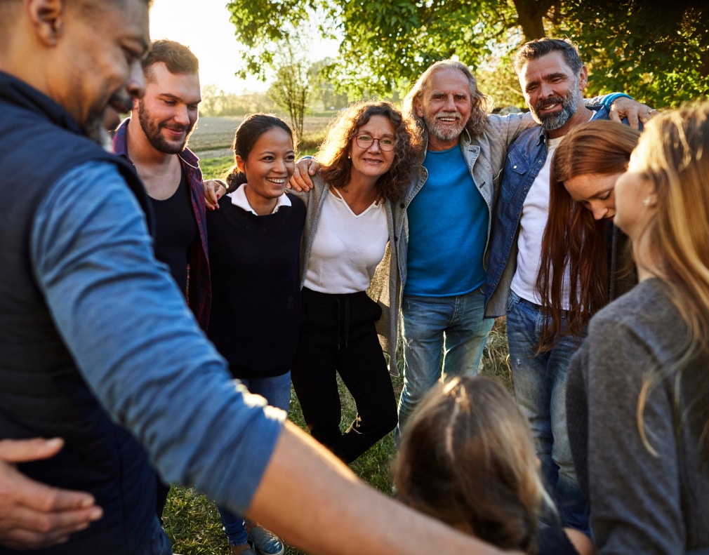 A group of people huddling together