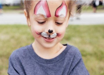 animal face paint on a little girl's face