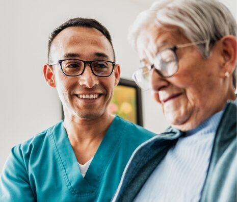 Nurse attending to elderly patient