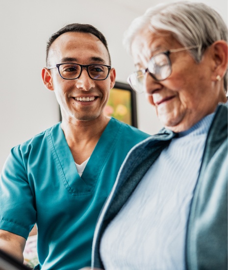 Nurse attending to elderly patient