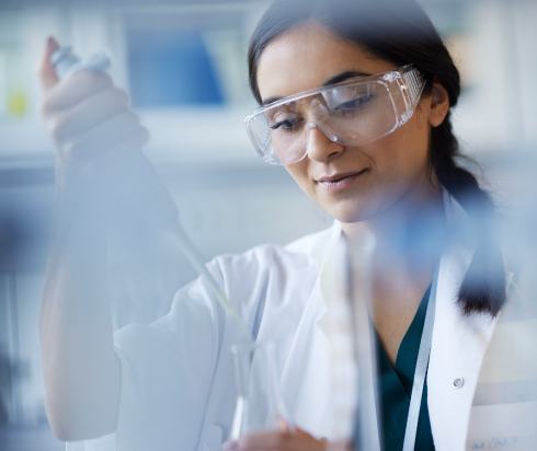 Researcher using tools in a lab