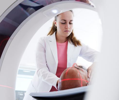 Radiologist performing scan on patient