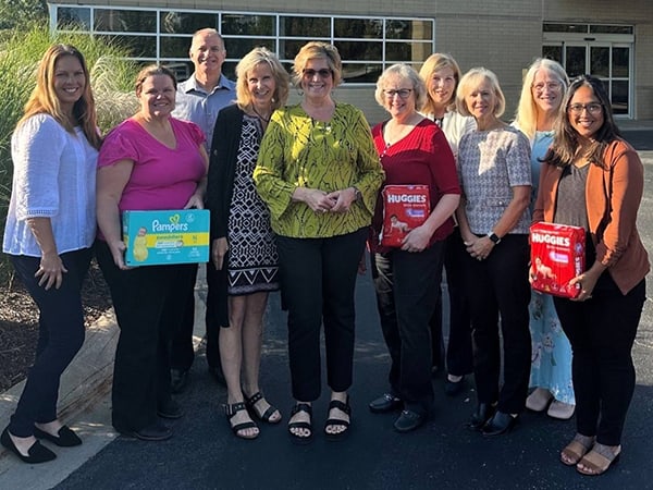 Employees of CAPTRUST’s Chesterton office, seen here with Franciscan Health Foundation Director of Development Debbie Tatum, center, recently donated $10,000 to Franciscan’s Prenatal Assistance Program to support its Diaper Pantry.