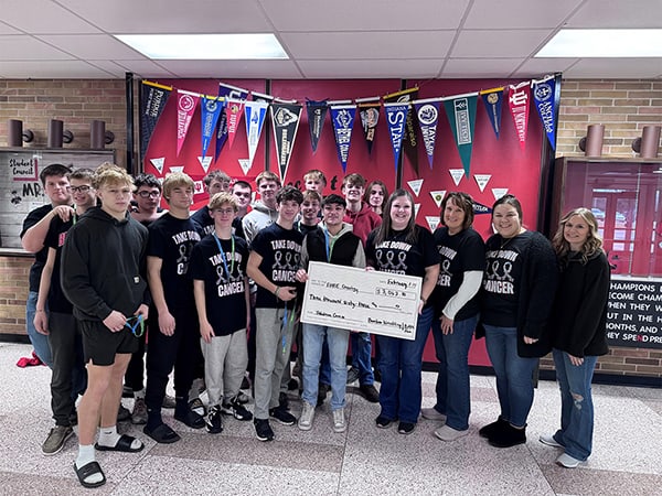 Rennselaer High School wrestling team presenting donation.