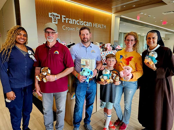 Representatives from The Eva Martin Project donated hundreds of stuffed animals and blankets for pediatric patients at Franciscan Health Crown Point last week. Pictured are (l-r) Maxine Moore, RN, nursing manager of the pediatric unit; Rick Martin, Sr.; Rick Martin, Jr., vice president of The Eva Martin Project; Lucas Martin; Rebekah Martin, president of The Eva Martin Project and Sister Benedicta, mission services coordinator at Franciscan Health Crown Point