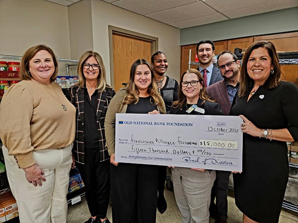 Representatives from Old National Bank recently gathered with Franciscan Health coworkers at Franciscan’s Crown Point Fresh Start Market to celebrate the bank’s $15,000 donation to the nonprofit Catholic healthcare ministry’s Food Insecurity Program
