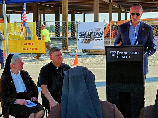 Representatives from Franciscan Health, The Dean and Barbara White Family Foundation and Tonn and Blank Construction joined community leaders and coworkers Tuesday morning for a topping off ceremony at the future Dean and Barbara White Cancer Center.