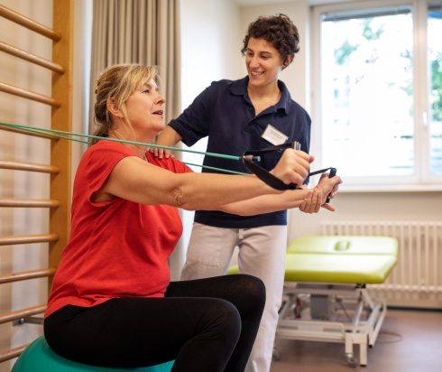 Physical therapist working with patient